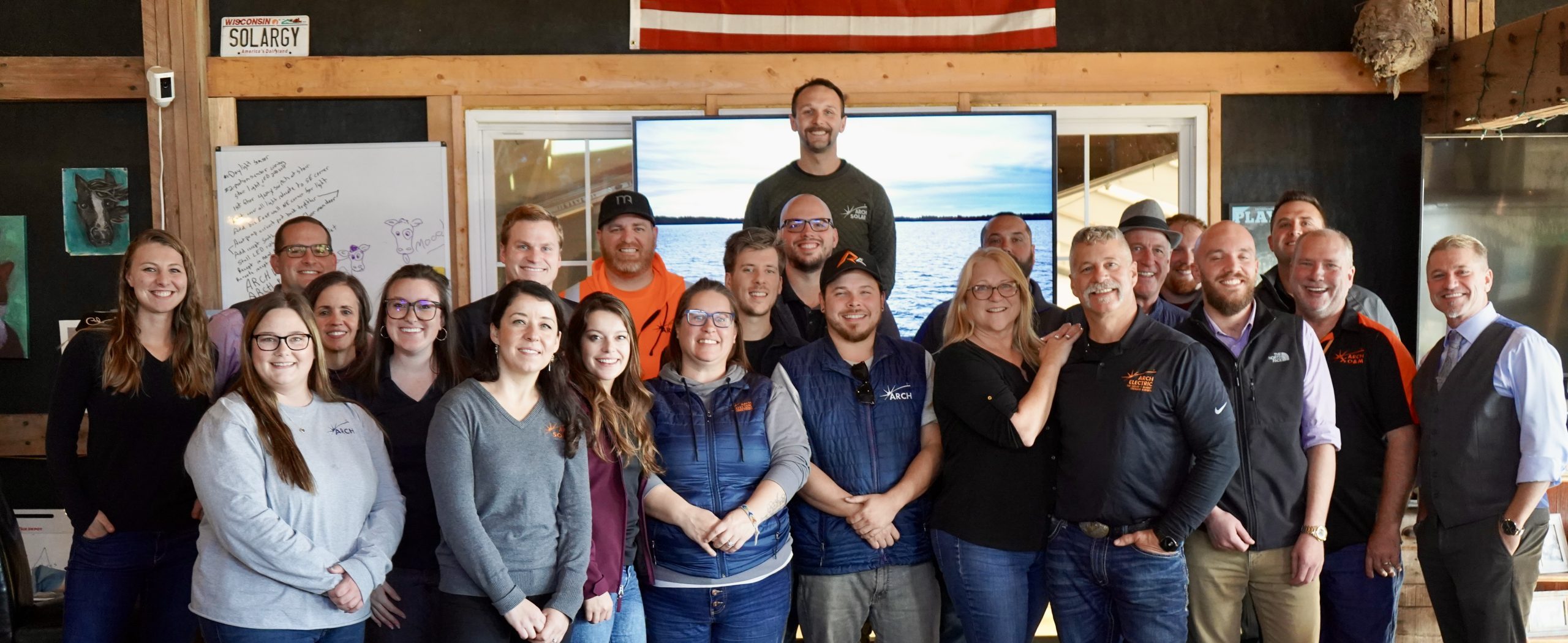 A group photo of Arch employees with NABCEP certifications.